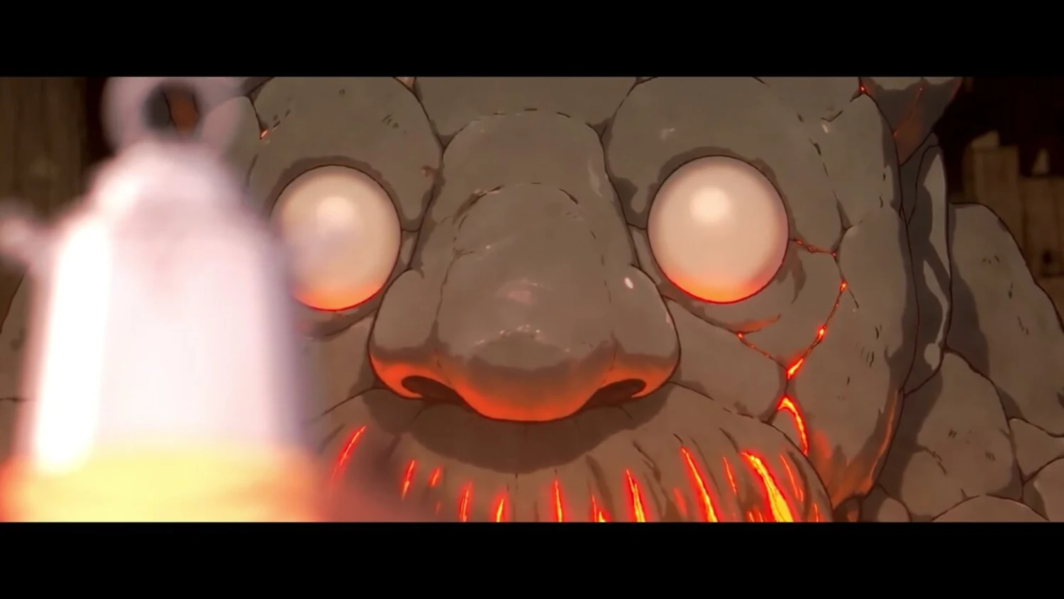 Bourdon in the finished episode: stone face, pale eyes, a beard of live flame lighting the bells behind him