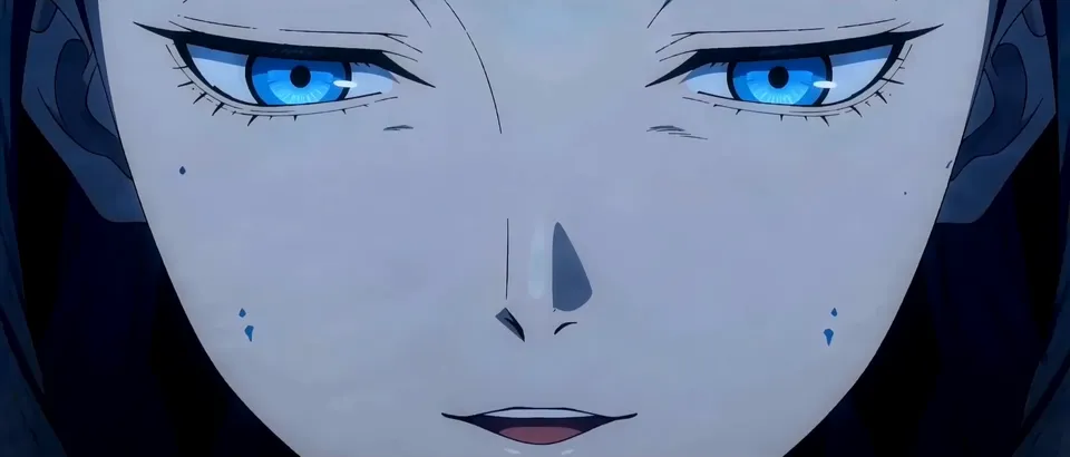 Extreme close-up of a giant pale face with piercing blue eyes