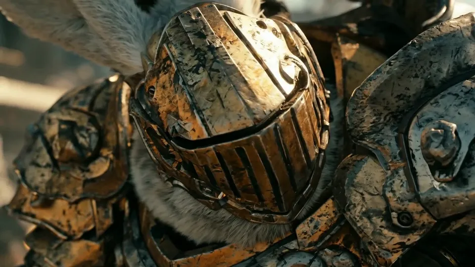 Close-up of a scratched brass helmet with a slotted visor, white fur showing at the collar